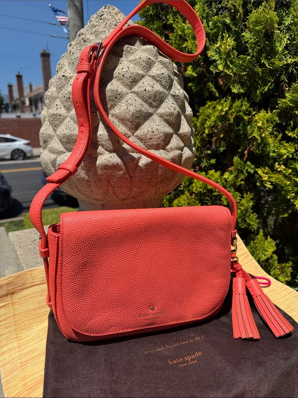 kate spade coral orange pebbled leather crossbody with tassels